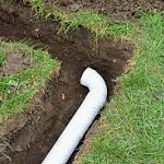 Large stack of 4" PVC drainage pipe