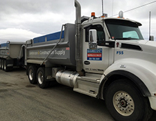 A view of our 14-tonne dump truck attached to its trailer.