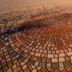 A circular pattern of red paving stones.